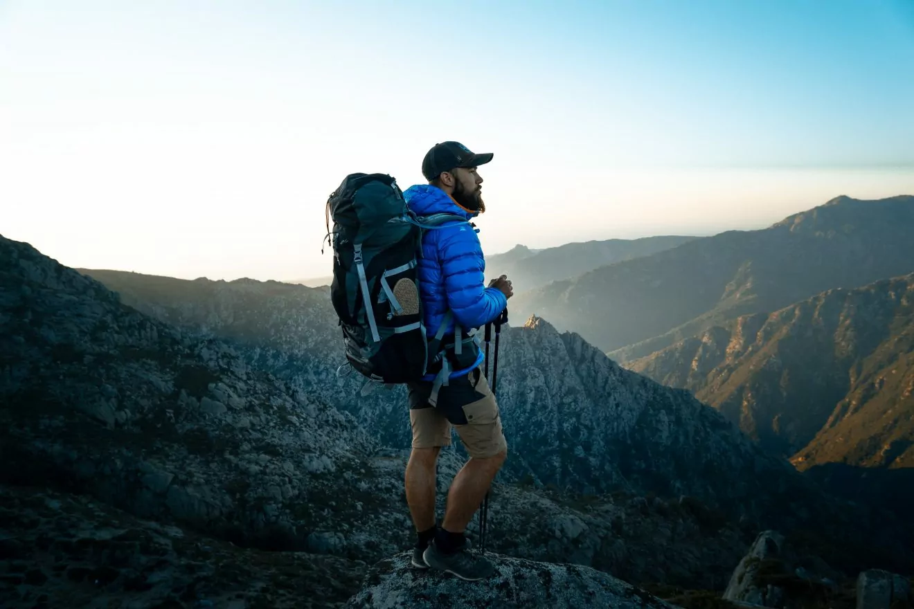 Backpacker standing at a vista point