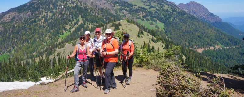 Group of hikers in front of landscape