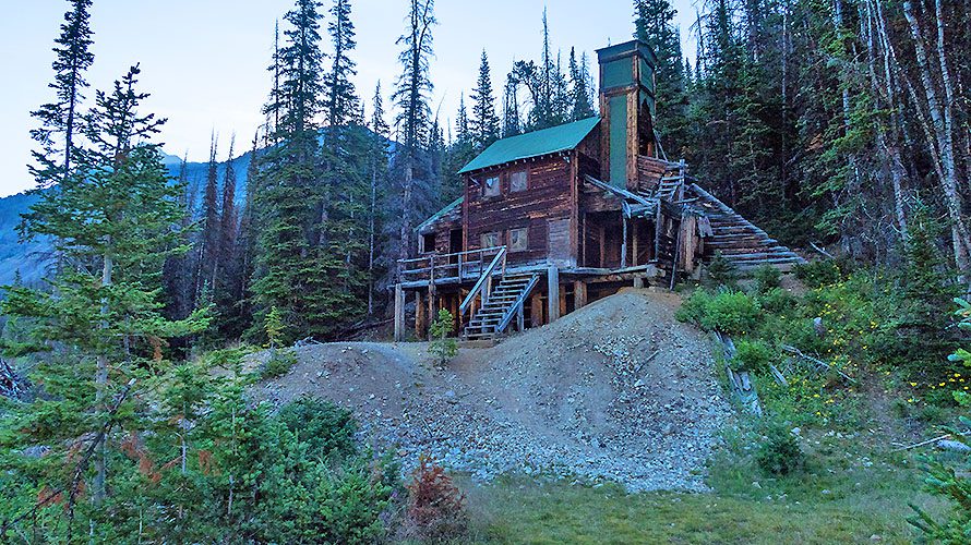 Multi-story log cabin on hill