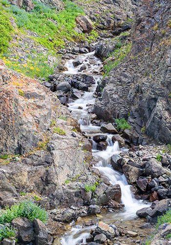 Mountain stream through rocky pass