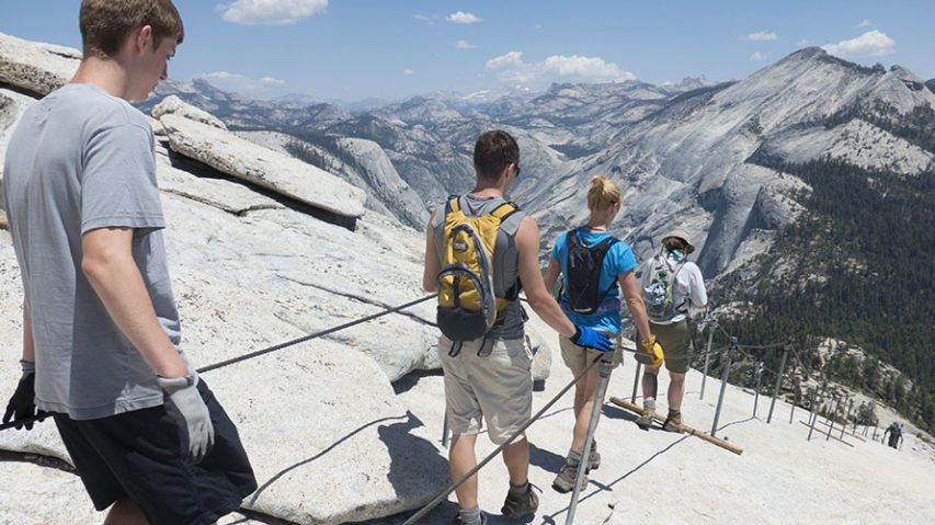 Hikers descending half dome