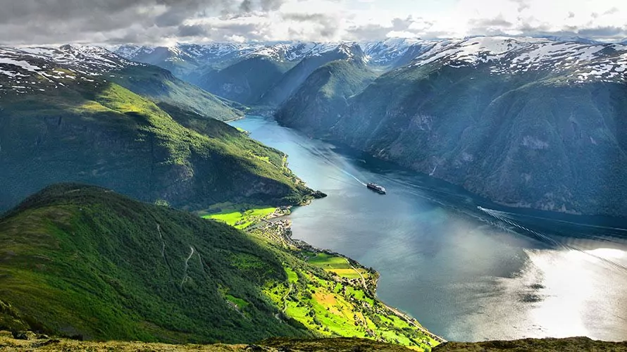 Vibrant green mountains with fjord