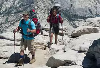 Two backpackers head up one of Yosemite's classic trails during summer