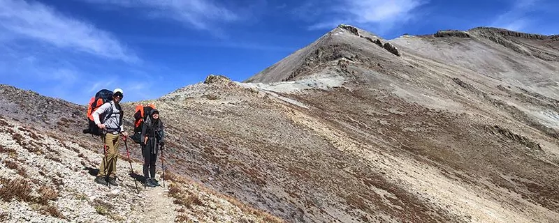 hikers on stony mountain