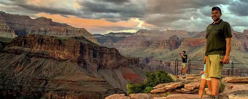Hikers in front of grand canyon