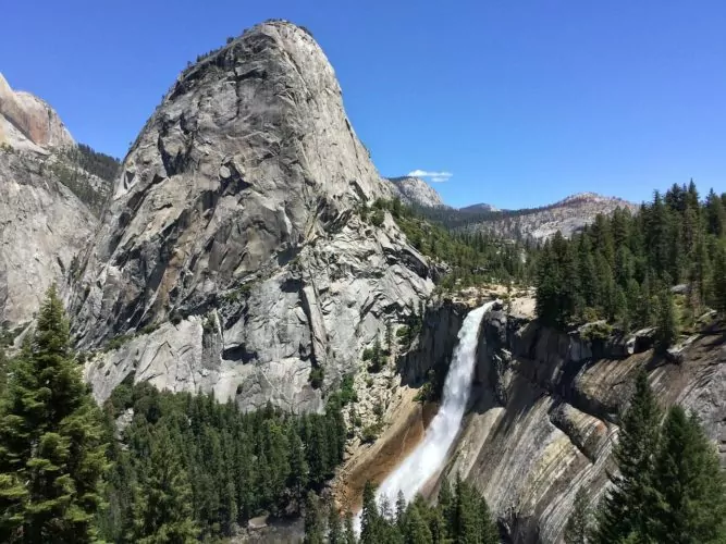 Yosemite Valley granite waterfall blue skies 