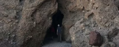 Hiker going into tunnel