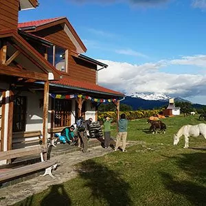 People on porch at a Patagonian inn