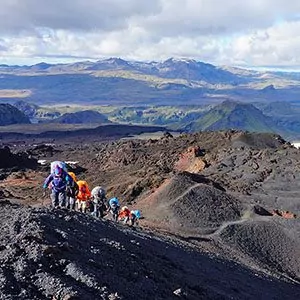 Group of hikers on rocky hills