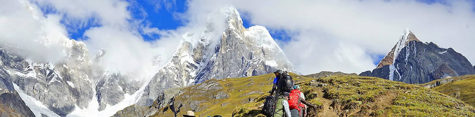 Hikers with the glaciated Cordillera Huayhuash behind, Peru