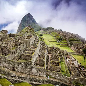 An iconic and historic site, Machu Picchu, rises above the clouds in Peru