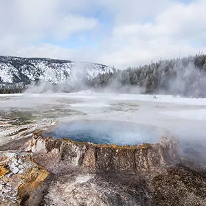 The geysers of Yellowstone National Park are covered with mist during winter