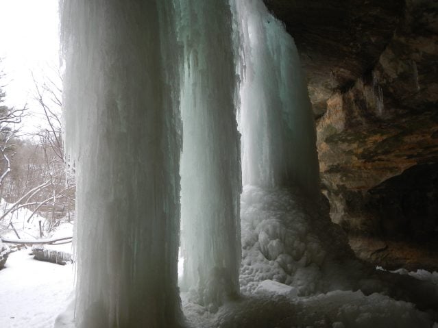 a winter hike without snowshoes to a frozen waterfall in lasalle canyon in starved rock state park illinois