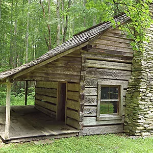 A historic lodge sits in the lush and wooded forests of the Great Smoky Mountains