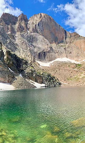 The Diamond in Rocky Mountain National Park is a popular climbing destination with Chasm Lake below to cool off in.