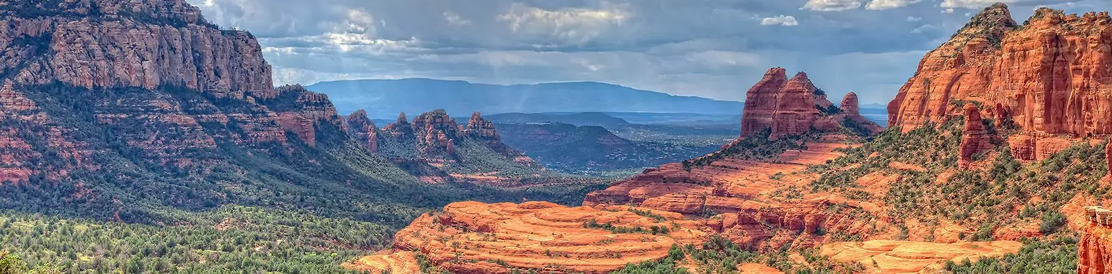 Storm clouds over Sedona cliffs and canyons