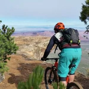 A mountain biker chooses their line on a ride along the canyon rim.
