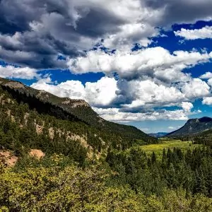 Clouds roll into the lush hills of  Rock Mountain National Park