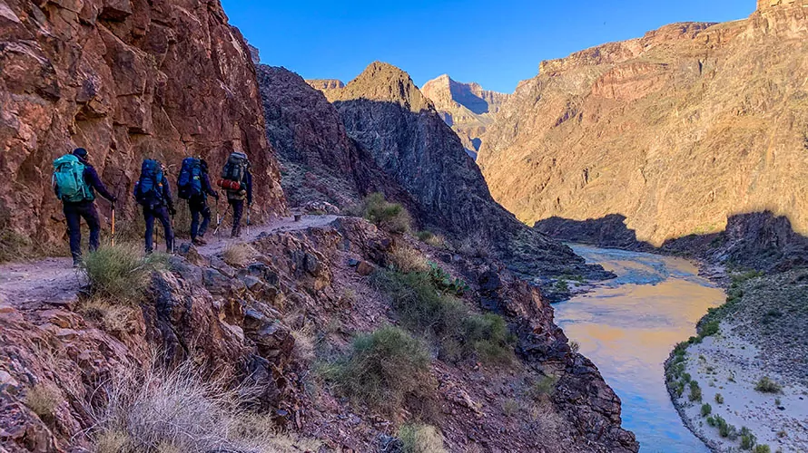 Backpackers hiking toward the bottom of the grand canyon