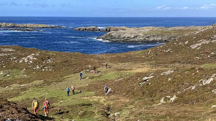 Hikers along the coast in ireland