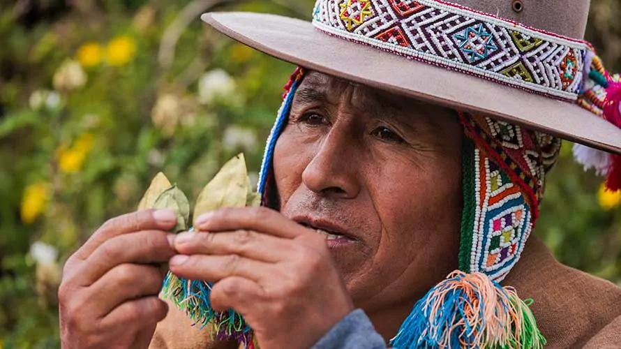 Man doing a traditional Incan Prosperity Ritual in Salkantay, Peru