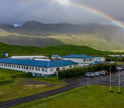 Hotel Skaftafell in Iceland with rainbow and mountains