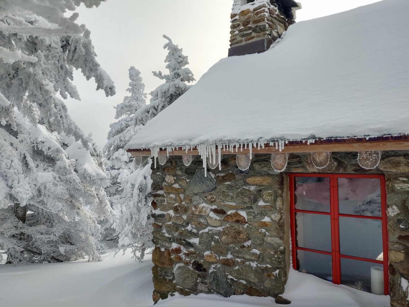 Snow on the roof of the Stone Hut, a backcountry hut in Vermont State Park system.