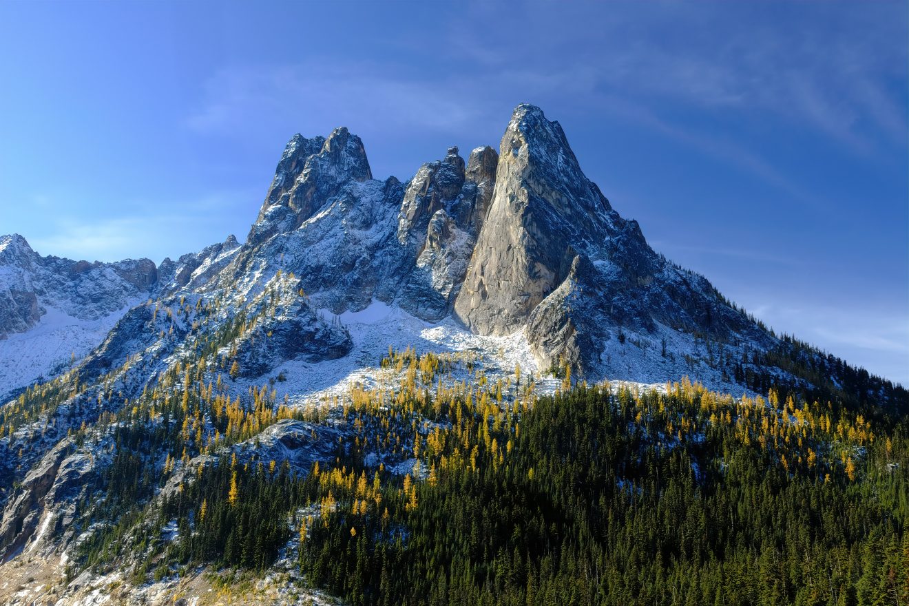 Washington Pass with a dusting of snow and a sprinkle of yellow from the larch trees in the fall.