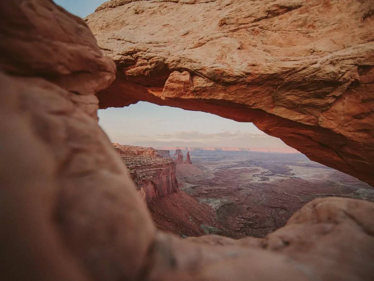Mesa Arch offering a view of the expanse of Canyonlands National Park