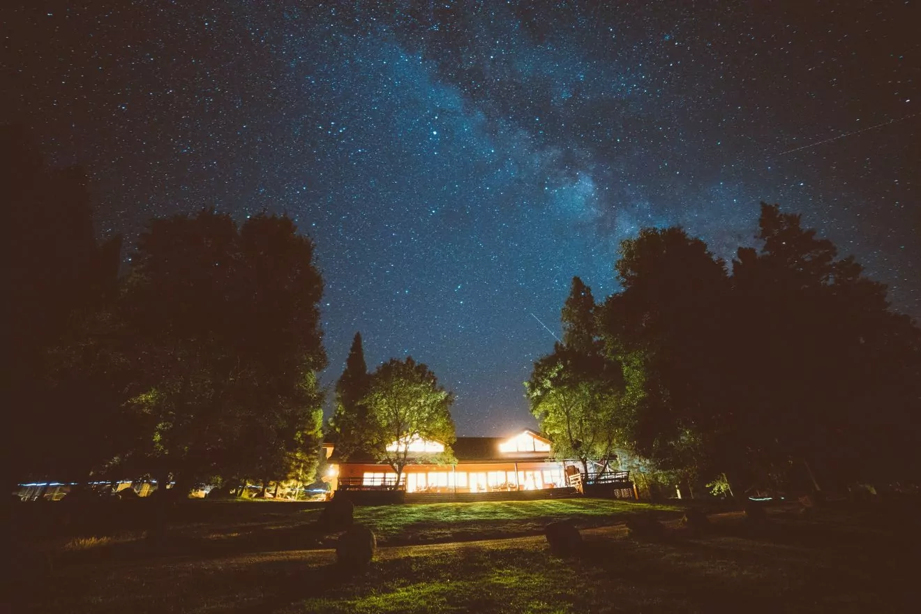 Lodge lit up at night in Yosemite National Park.