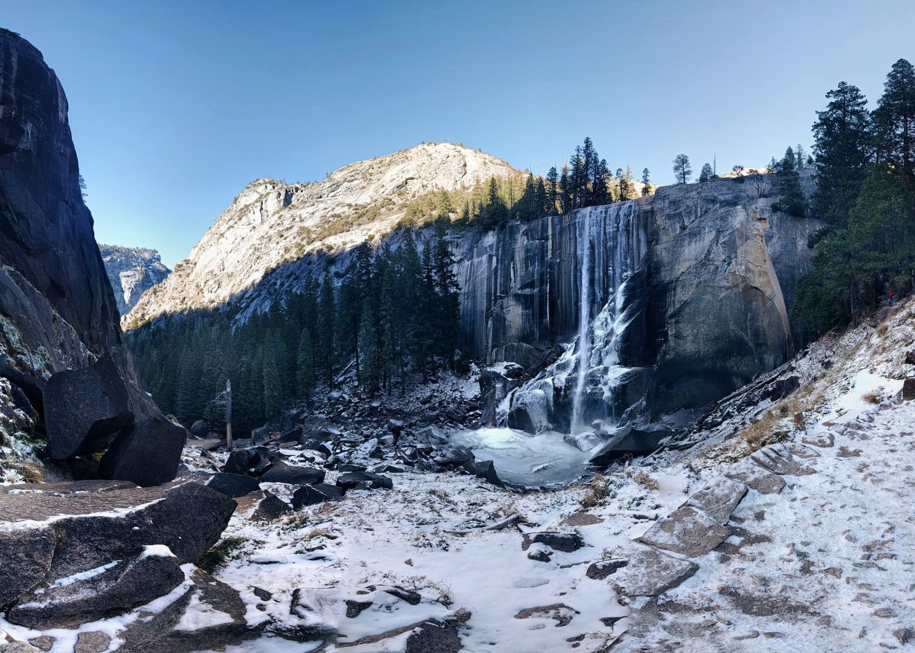 Vernal Falls in Yosemite covered in ice and snow in the winter.