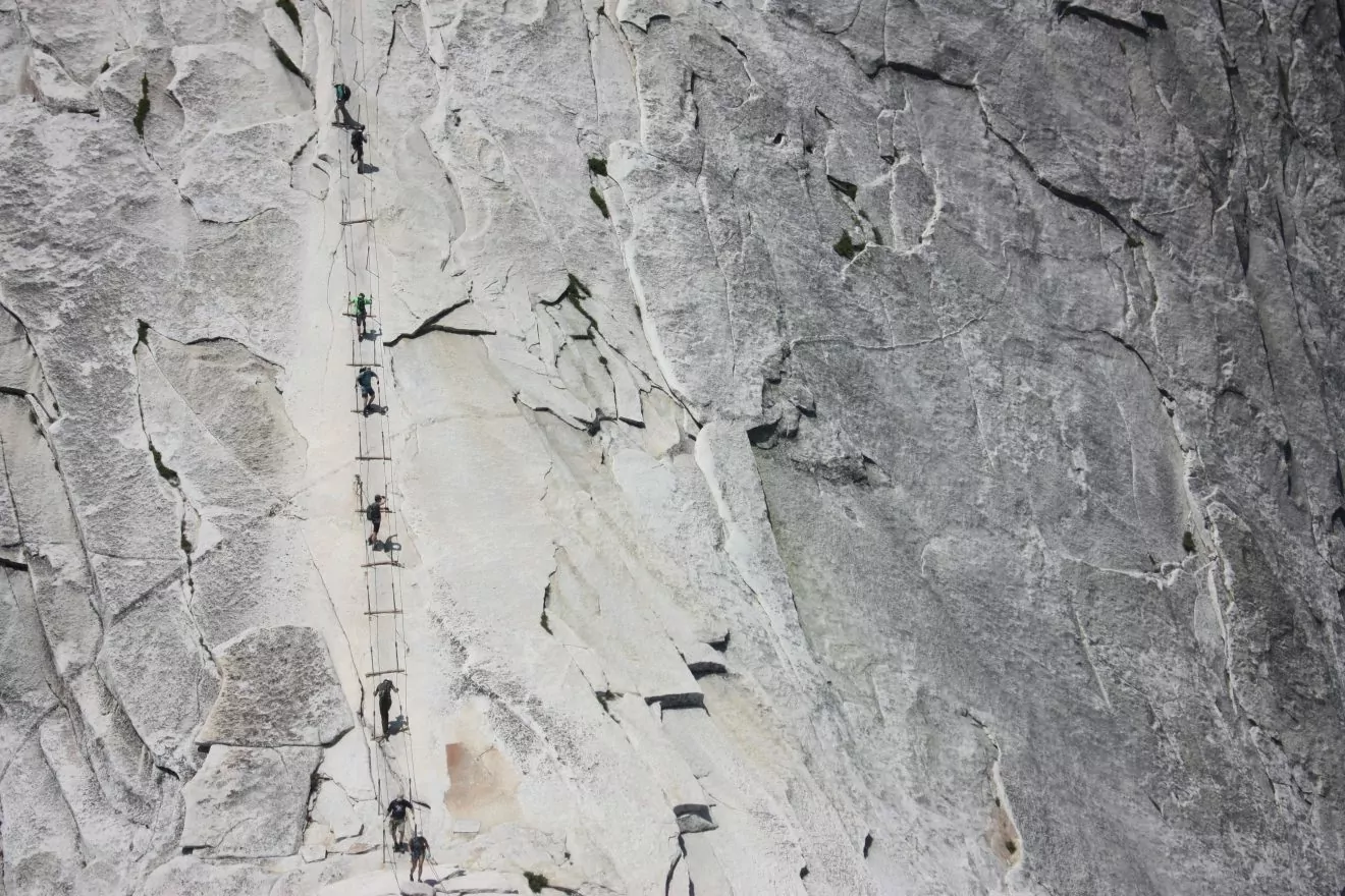 Hikers on the half dome cables