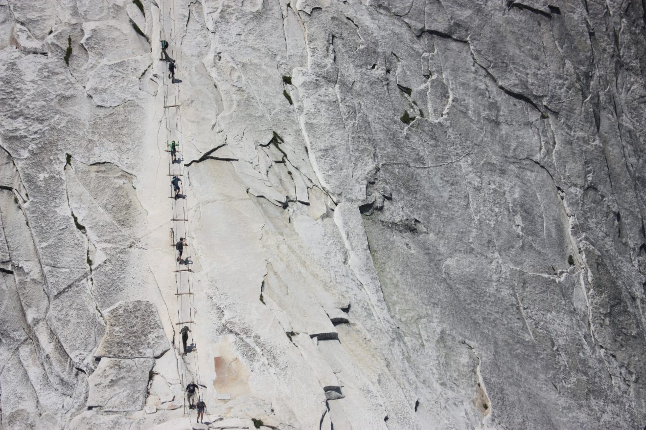 Hikers on the half dome cables