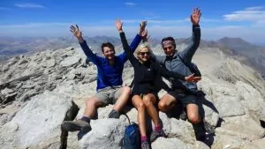 hiking back packing summit peak yosemite June hikers three hands happy