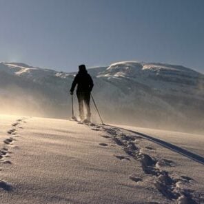 backpacking yellowstone in March snow ski snowshoe footprints wind storm winter