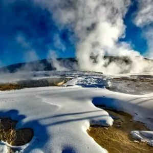 Yellowstone in March geyser steam snow hot springs water