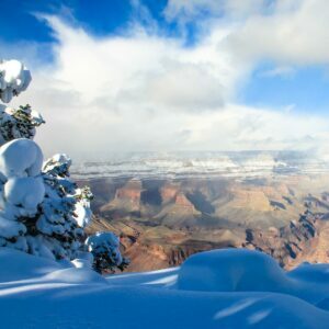 backpacking grand canyon in January snow vista clouds sky trees.