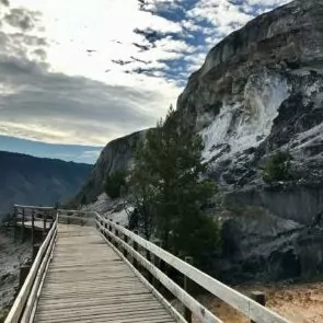 hiking Yellowstone in October boardwalk mountain sky clouds rock granite railing fall autumn