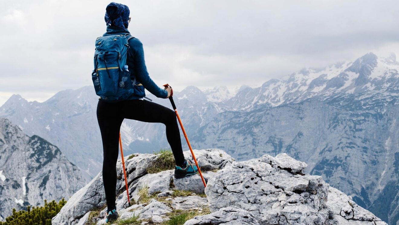 Solo hiker reaches the summit in winter