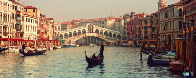 Rialto Bridge and gondolas in Venice.