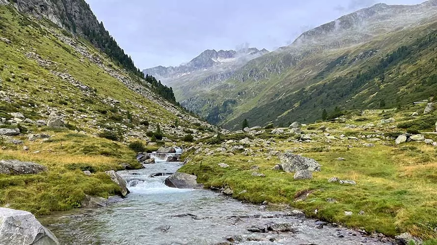 Creek and alpine mountains in the European Alps