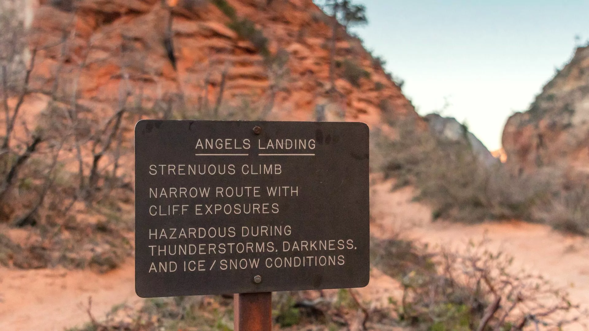 Warning sign about dangers of Angels Landing hike Zion