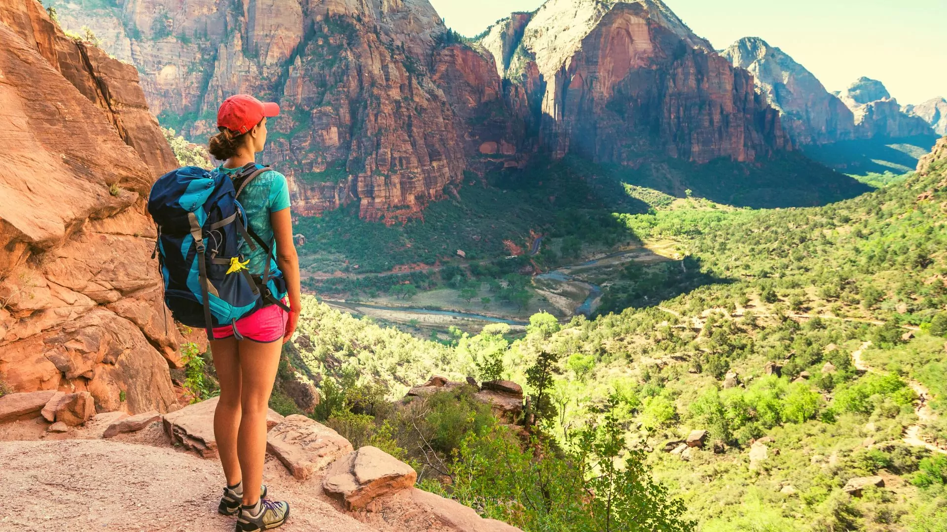 Hiker on West Rim Trail looks out at Zion Canyon
