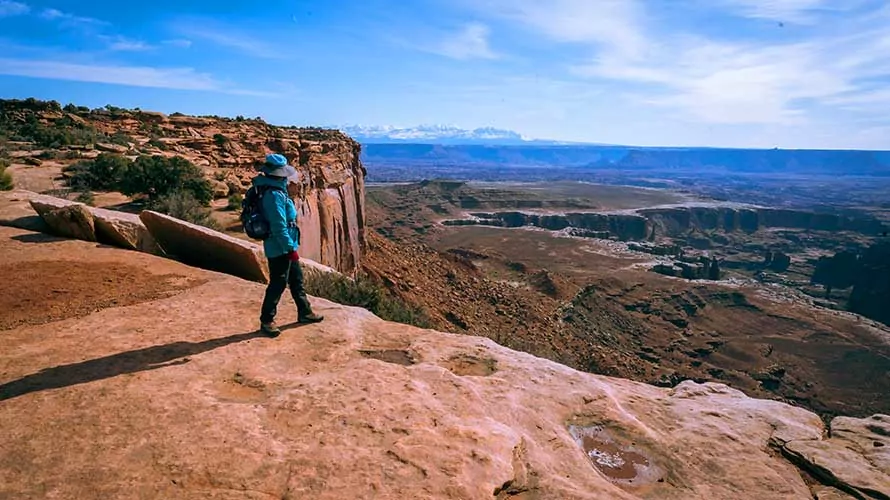 Hiker looking out from Island in the Sky in Canyonlands National Park