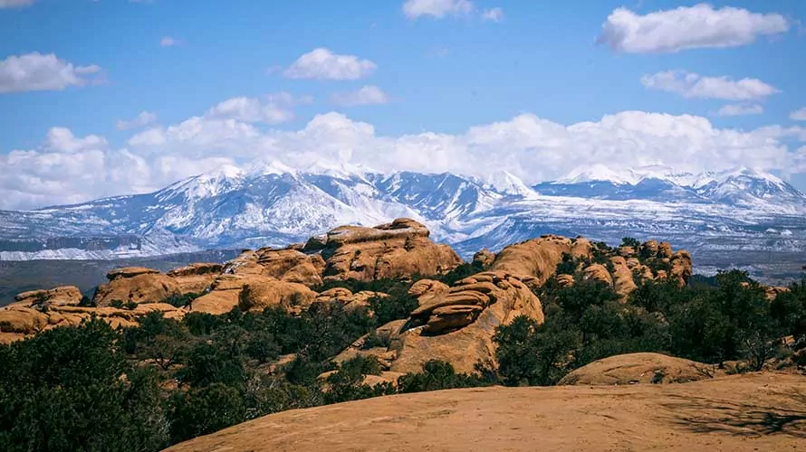 Snow covered La Sal Mountains from the Devils Garden Trail in Arches National Park