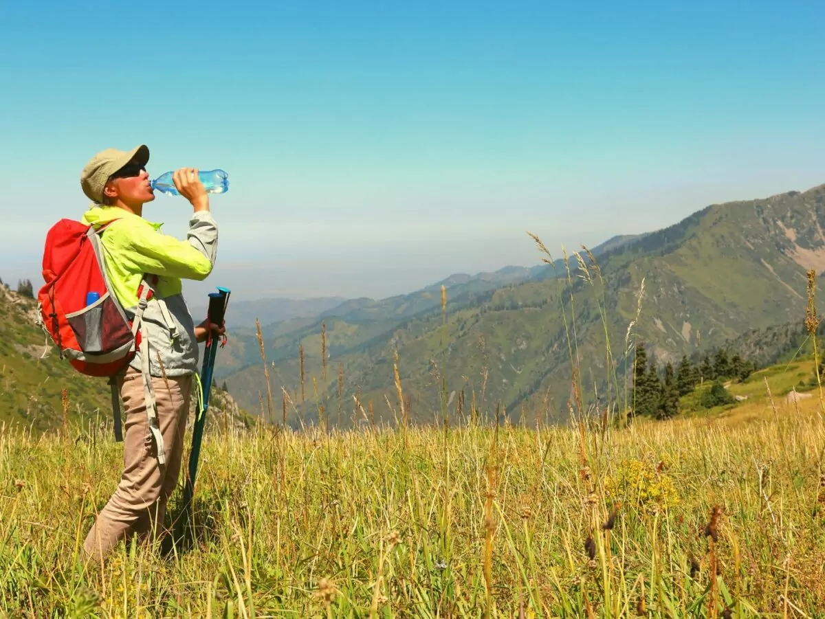 Drinking water while hiking in the backcountry