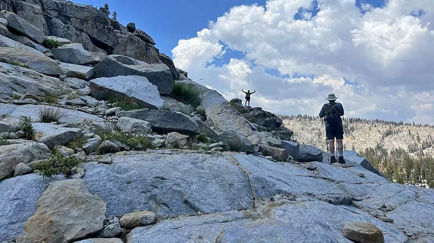 Hikers on the granite slabs of the High Sierra in California