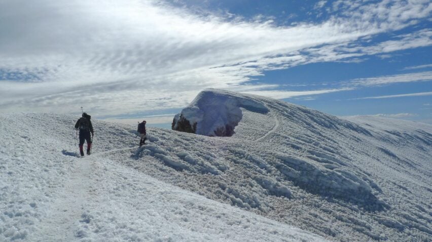 Climbing snowy mount hood summit