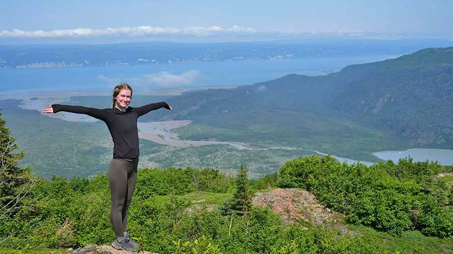 Woman celebrating the views in Alaska's Kenai Peninsula