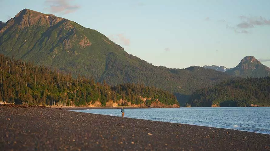 Hiker on a beach on the Kenai Peninsula, Alaska